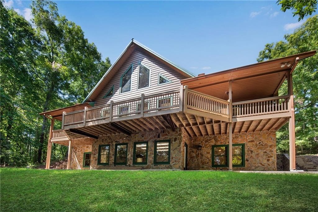 5 bedroom, 6 bathroom, 5,302 sq ft single family residence for sale at 1300 Soap Creek Road, Ball Ground, GA 30107 — photo 2