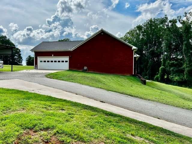 7 bedroom, 4 bathroom, 4,578 sq ft single family residence for sale at 7643 Highway 145, Carnesville, GA 30521 — photo 2