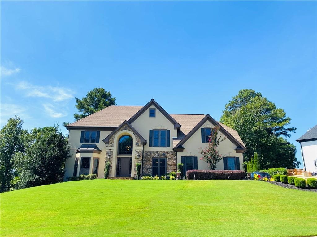 5 bedroom, 4 bathroom, 4,971 sq ft single family residence for sale at 10295 Groomsbridge Road, Johns Creek, GA 30022