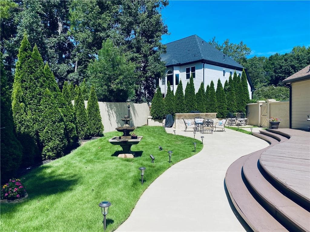5 bedroom, 4 bathroom, 4,971 sq ft single family residence for sale at 10295 Groomsbridge Road, Johns Creek, GA 30022 — photo 10
