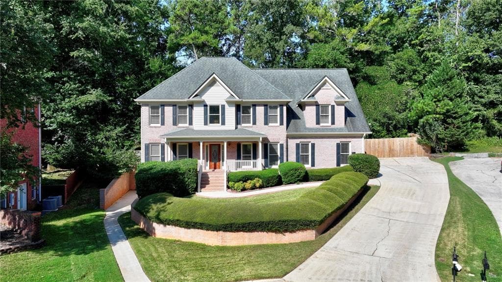 4 bedroom, 5 bathroom, 4,614 sq ft single family residence for sale at 100 Harmony Point Cove, Lilburn, GA 30047 — photo 2