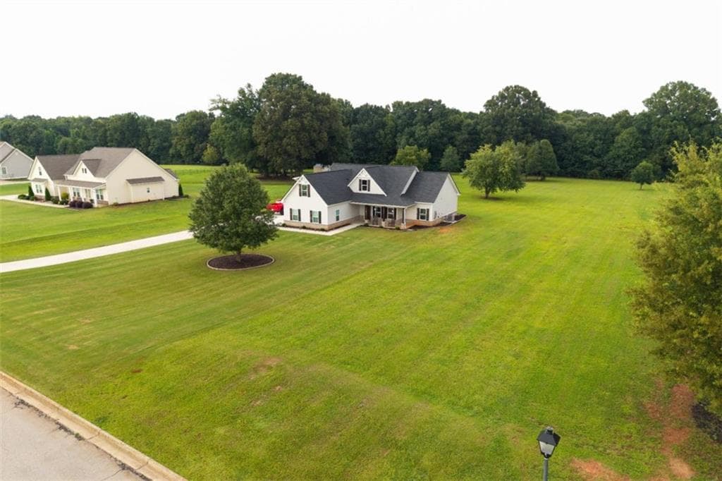 4 bedroom, 3 bathroom, 2,282 sq ft single family residence for sale at 301 Savannah Drive, Mansfield, GA 30055 — photo 2