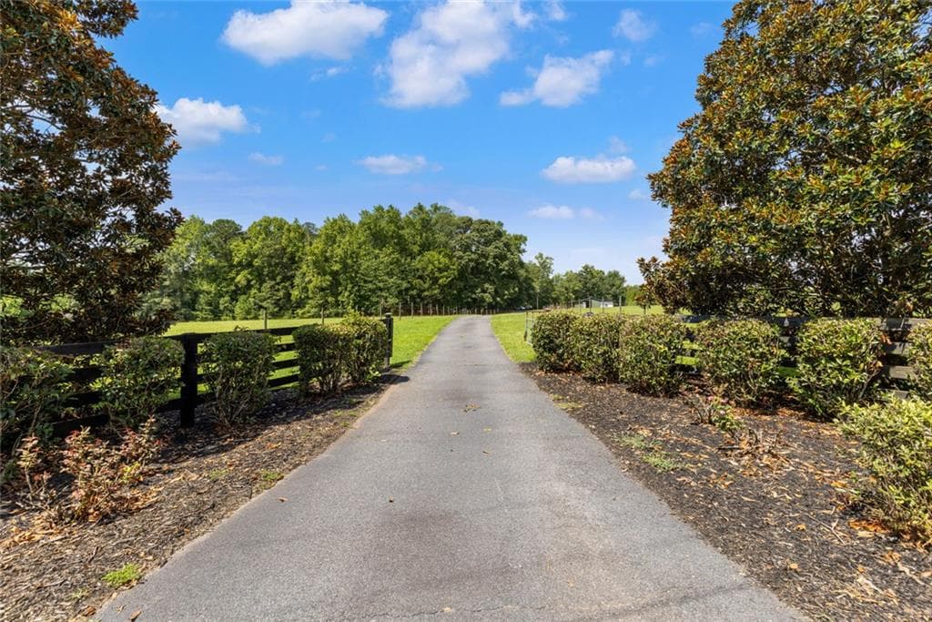 3 bedroom, 2 bathroom, 1,876 sq ft single family residence under contract at 1064 Chappell Mill Road, Milner, GA 30257 — photo 2