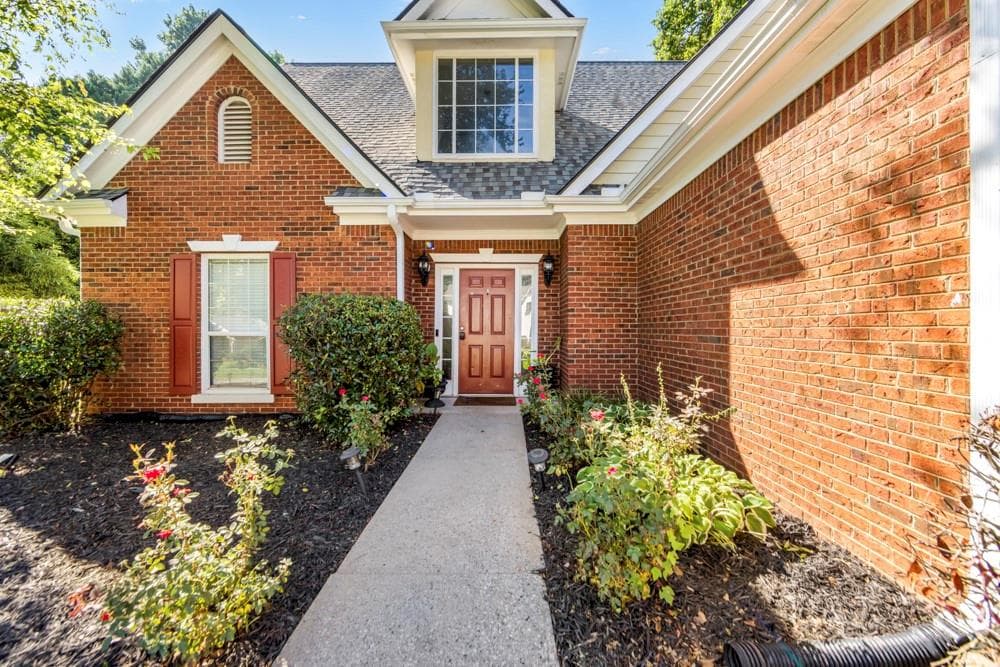 4 bedroom, 3 bathroom, 2,167 sq ft single family residence for sale at 165 Roberts Road, Suwanee, GA 30024 — photo 2
