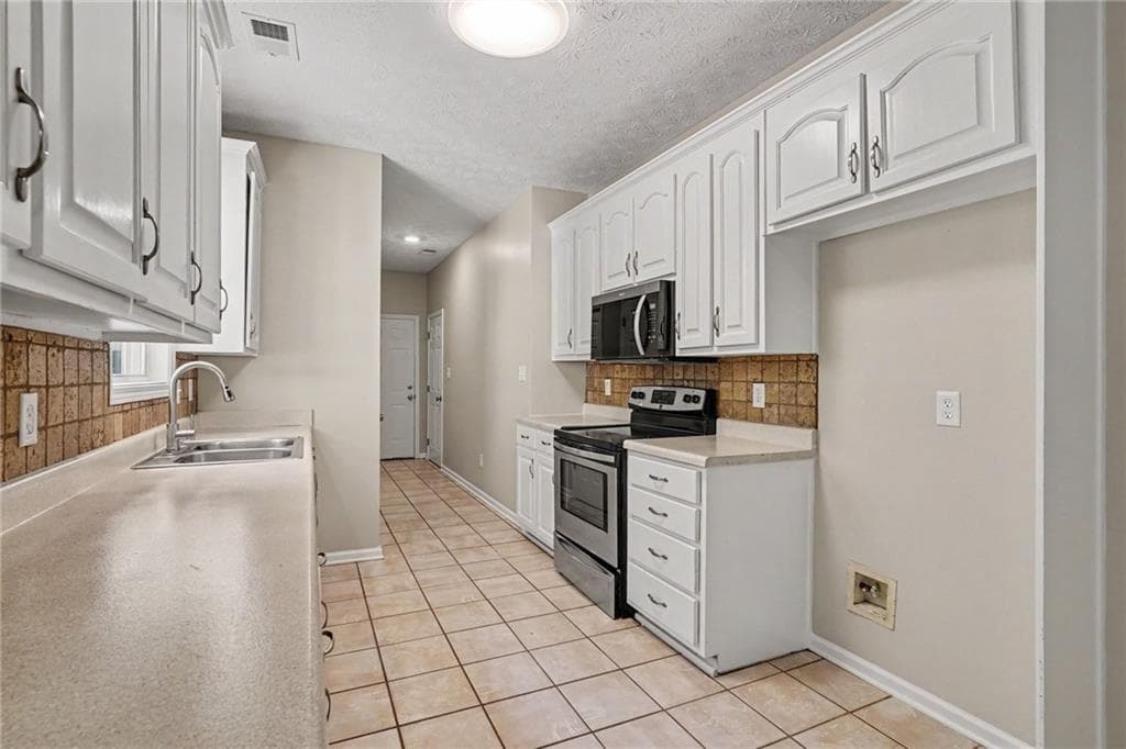 4 bedroom, 2 bathroom, 2,164 sq ft single family residence for sale at 1279 Coan Drive, Locust Grove, GA 30248 — photo 7