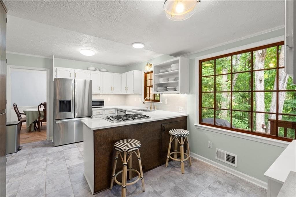 4 bedroom, 3 bathroom, 2,576 sq ft single family residence for sale at 3973 Guilford Court, Lilburn, GA 30047 — photo 6