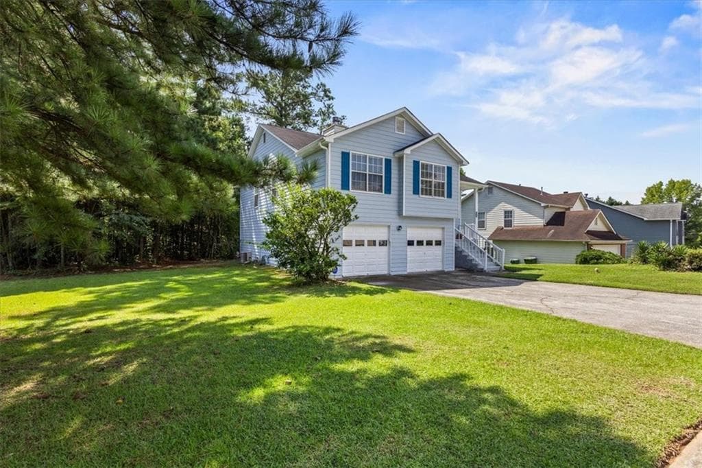 4 bedroom, 3 bathroom, 1,673 sq ft single family residence under contract at 5604 Rockingwood Lane, Atlanta, GA 30349 — photo 2