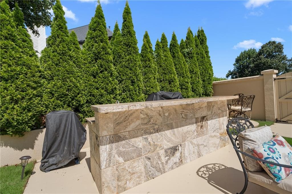 5 bedroom, 4 bathroom, 4,971 sq ft single family residence for sale at 10295 Groomsbridge Road, Johns Creek, GA 30022 — photo 6
