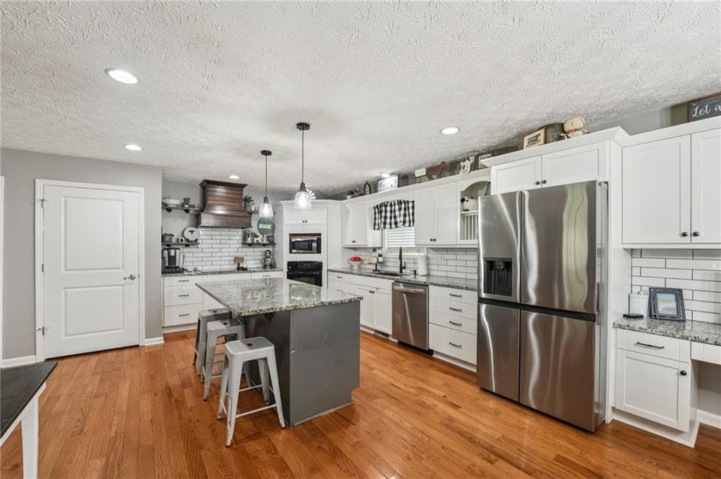 5 bedroom, 3 bathroom, 3,660 sq ft single family residence for sale at 6471 Forsyth Drive, Cumming, GA 30028 — photo 8