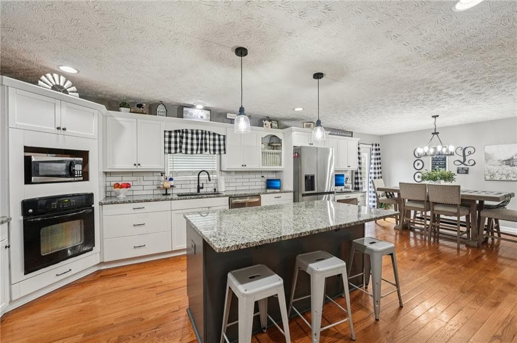 5 bedroom, 3 bathroom, 3,660 sq ft single family residence for sale at 6471 Forsyth Drive, Cumming, GA 30028 — photo 9
