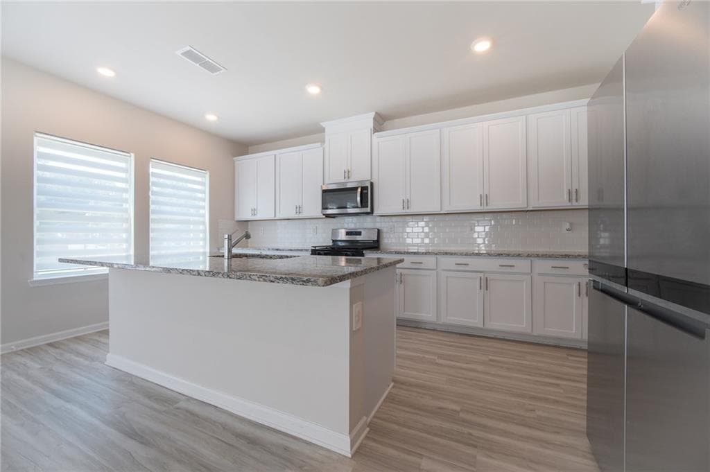 4 bedroom, 3 bathroom, 2,632 sq ft single family residence for sale at 3774 Commodore Court, Buford, GA 30519 — photo 6