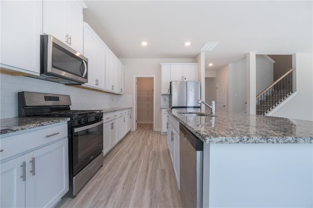 4 bedroom, 3 bathroom, 2,632 sq ft single family residence for sale at 3774 Commodore Court, Buford, GA 30519 — photo 8