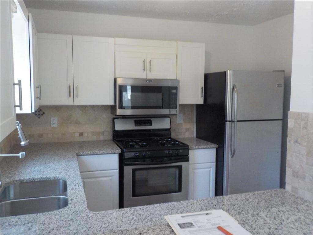 4 bedroom, 3 bathroom, 1,574 sq ft single family residence for sale at 2169 Victoria Place, Lithonia, GA 30058 — photo 6