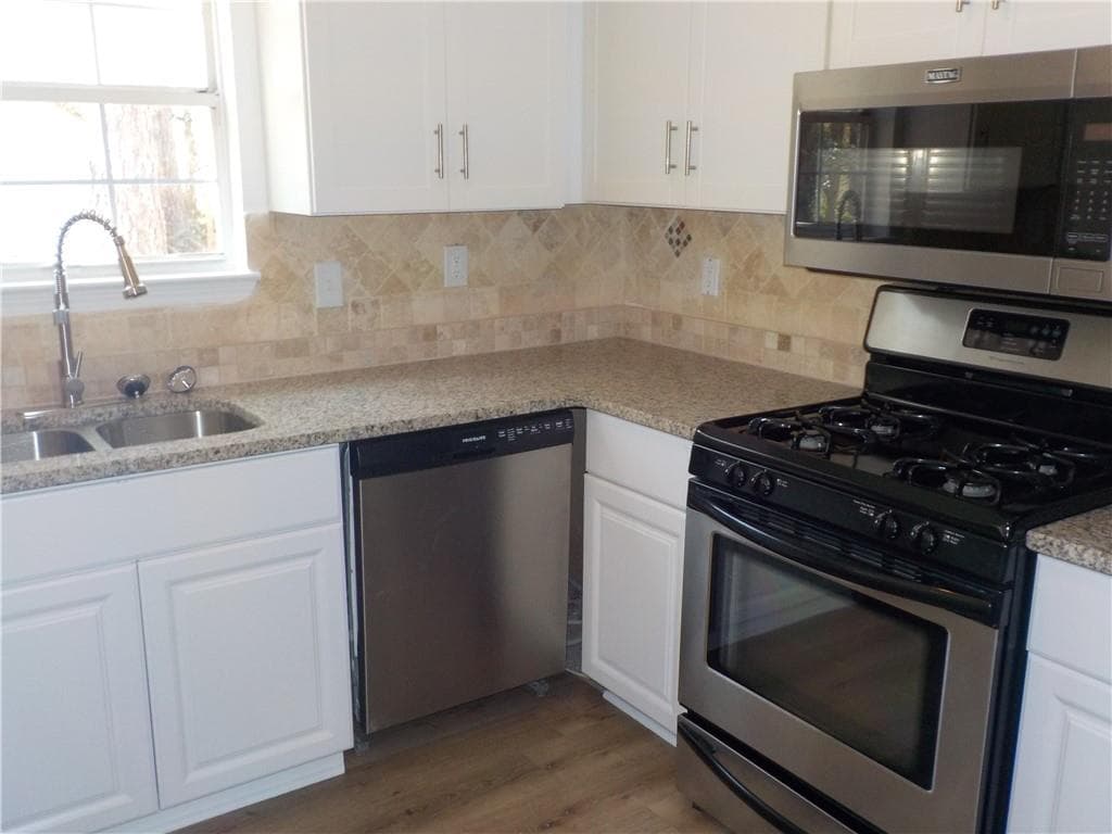4 bedroom, 3 bathroom, 1,574 sq ft single family residence for sale at 2169 Victoria Place, Lithonia, GA 30058 — photo 7