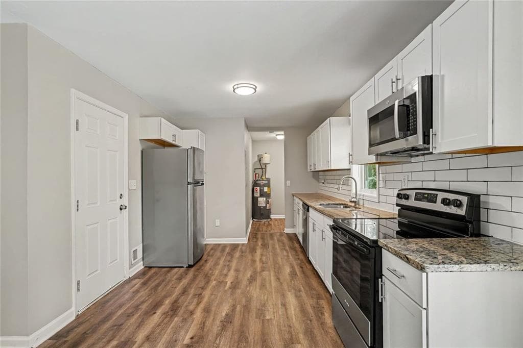 4 bedroom, 3 bathroom, 1,315 sq ft single family residence for sale at 5920 Rolling Oaks Drive, Cumming, GA 30040 — photo 10