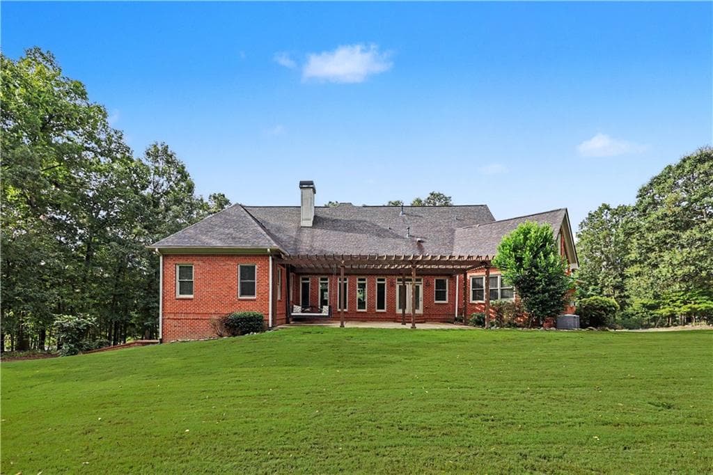 7 bedroom, 6 bathroom, 7,650 sq ft single family residence for sale at 8415 Glen Lake Drive, Cumming, GA 30028 — photo 5