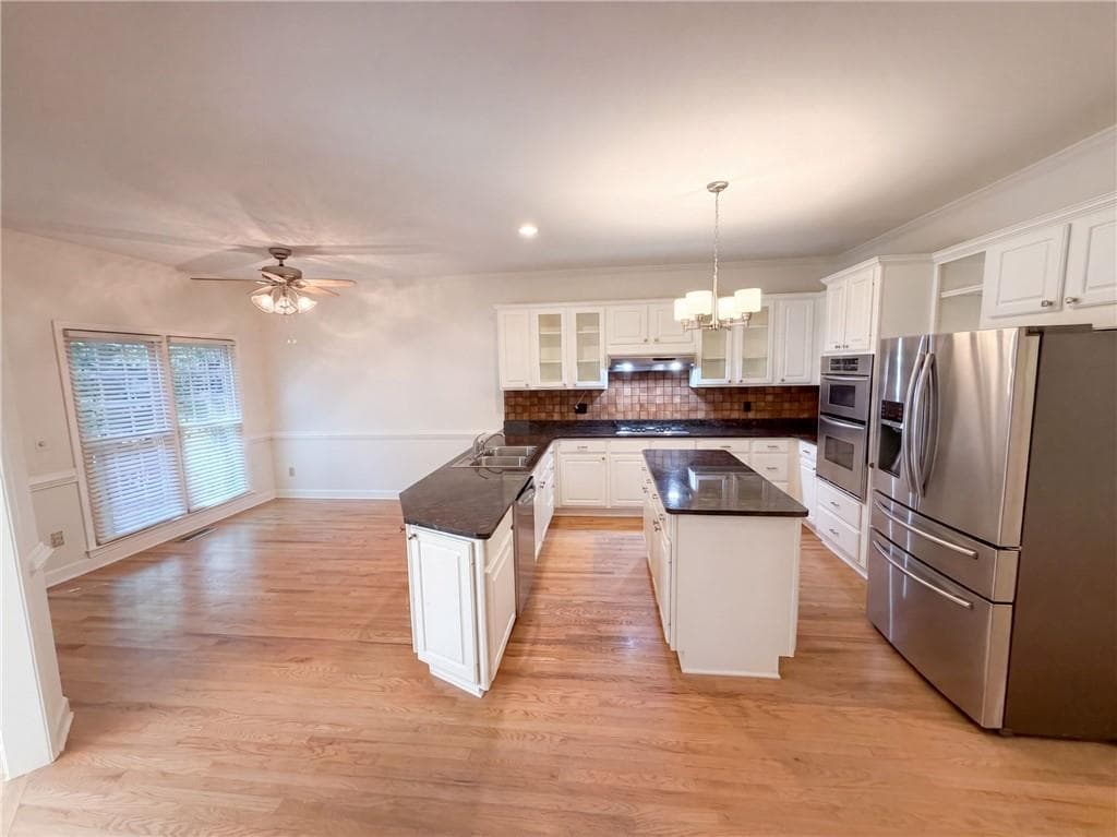 6 bedroom, 4 bathroom, 4,712 sq ft single family residence for sale at 3320 Sweetwater Drive, Cumming, GA 30041 — photo 2