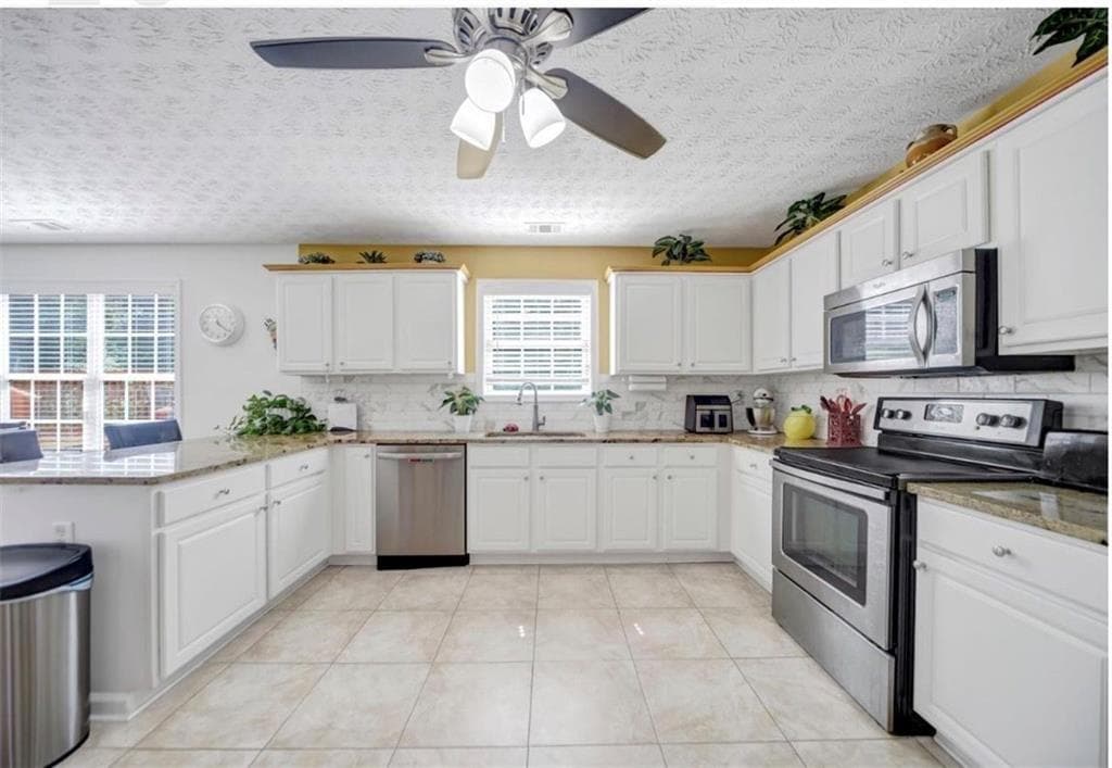 5 bedroom, 3 bathroom, 3,436 sq ft single family residence for sale at 3202 Kittery Drive, Snellville, GA 30039 — photo 6