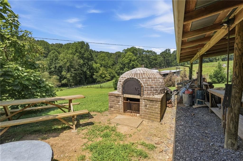 4 bedroom, 3 bathroom, 1,820 sq ft single family residence for sale at 1673 Rackley Road, Ellijay, GA 30536 — photo 4