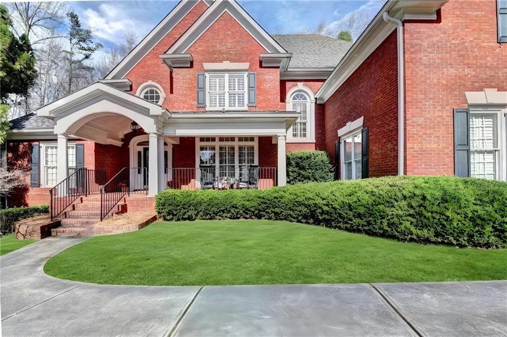 5 bedroom, 5 bathroom, 6,753 sq ft single family residence for sale at 7040 Laurel Oak Drive, Suwanee, GA 30024 — photo 2