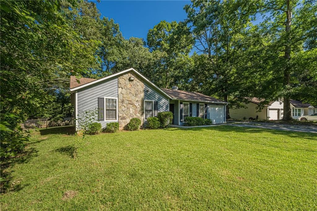 3 bedroom, 2 bathroom, 1,212 sq ft single family residence for sale at 5350 Greenhedge Trail, Stone Mountain, GA 30088 — photo 2
