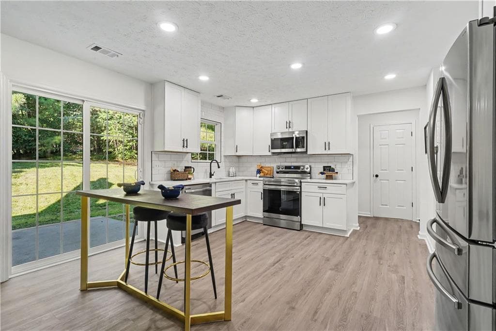 4 bedroom, 3 bathroom, 2,321 sq ft single family residence for sale at 680 Dot Drive, Atlanta, GA 30349 — photo 7