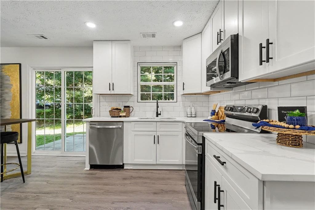 4 bedroom, 3 bathroom, 2,321 sq ft single family residence for sale at 680 Dot Drive, Atlanta, GA 30349 — photo 8