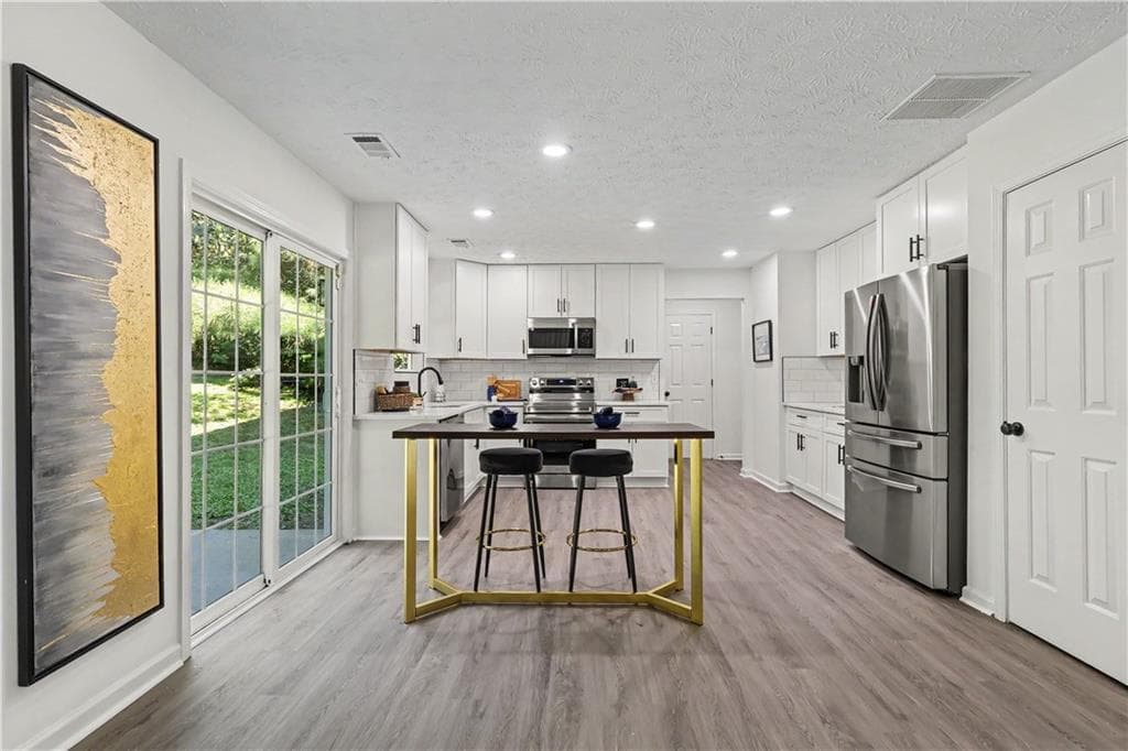 4 bedroom, 3 bathroom, 2,321 sq ft single family residence for sale at 680 Dot Drive, Atlanta, GA 30349 — photo 9