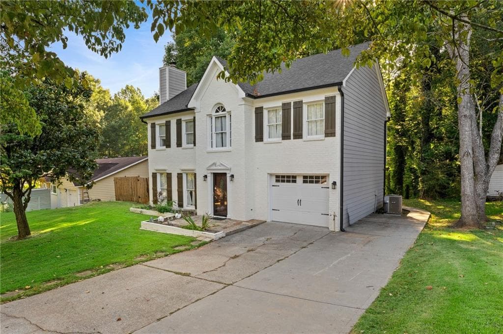 4 bedroom, 4 bathroom, 2,314 sq ft single family residence for sale at 661 Sunfield Drive, Lilburn, GA 30047 — photo 2
