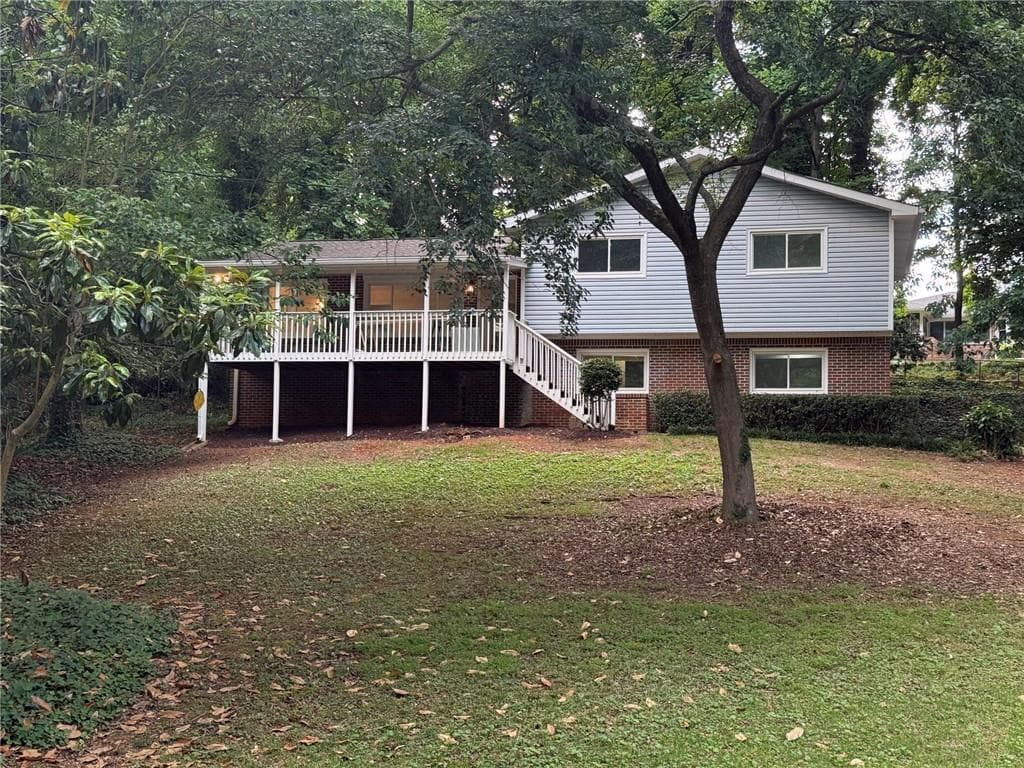 4 bedroom, 3 bathroom, 2,072 sq ft single family residence for sale at 5641 Stone Court, Stone Mountain, GA 30087 — photo 2