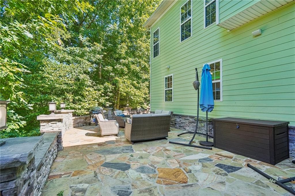 5 bedroom, 4 bathroom, 4,100 sq ft single family residence for sale at 5448 Speckled Wood Lane, Gainesville, GA 30506 — photo 7