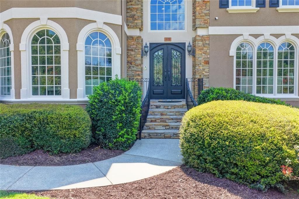 6 bedroom, 5 bathroom, 6,842 sq ft single family residence for sale at 4105 Falls Ridge Drive, Johns Creek, GA 30022 — photo 4