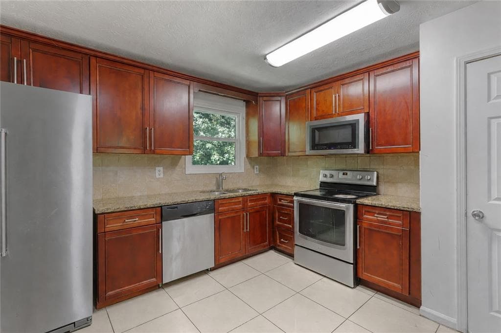 5 bedroom, 3 bathroom, 1,592 sq ft single family residence for sale at 1563 Greenwood Drive, Norcross, GA 30093 — photo 2