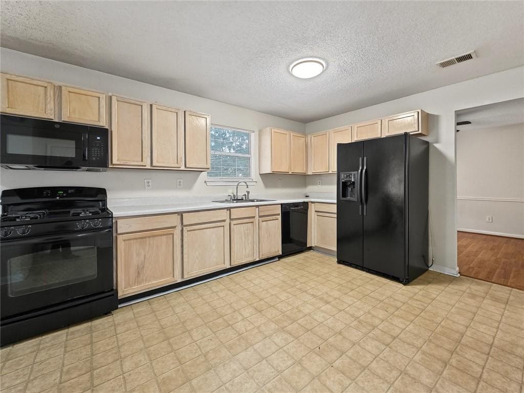 4 bedroom, 3 bathroom, 2,006 sq ft single family residence for sale at 2416 Rambling Way, Lithonia, GA 30058 — photo 2