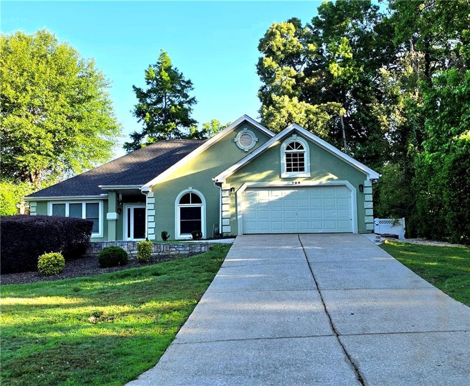 3 bedroom, 2 bathroom, 2,576 sq ft single family residence for sale at 709 Oak Moss Drive, Lawrenceville, GA 30043 — photo 2