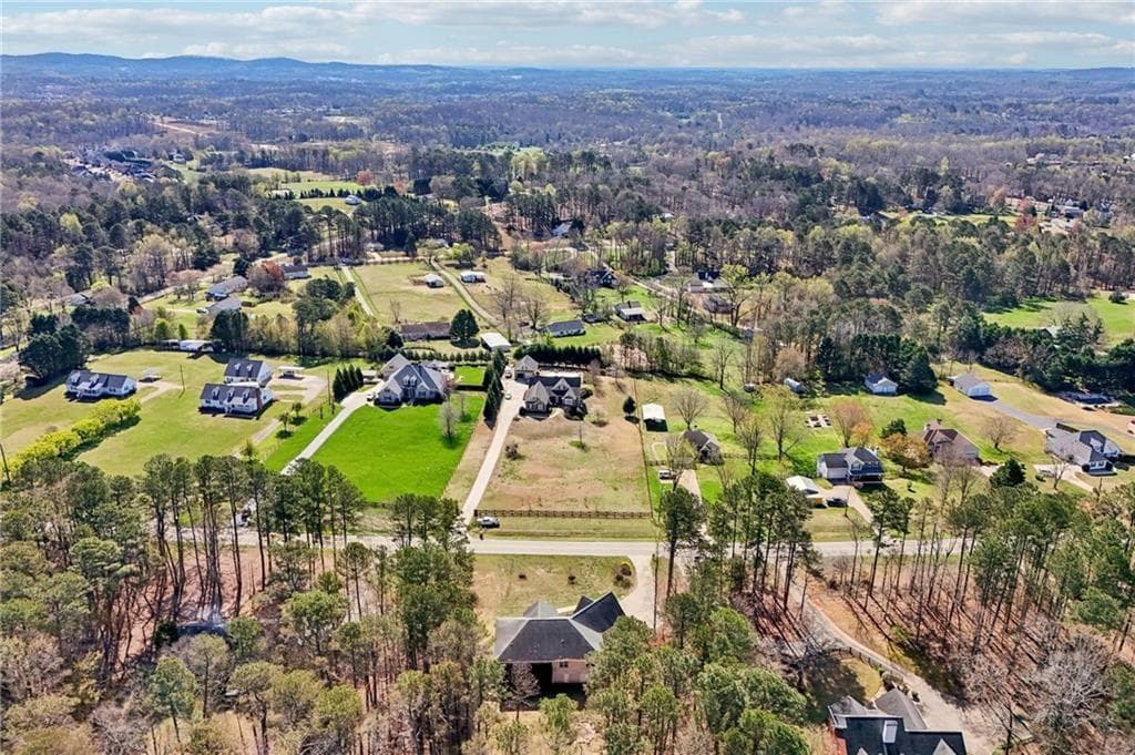 4 bedroom, 3 bathroom, 2,582 sq ft single family residence for sale at 7055 Bannister Road, Cumming, GA 30028 — photo 4