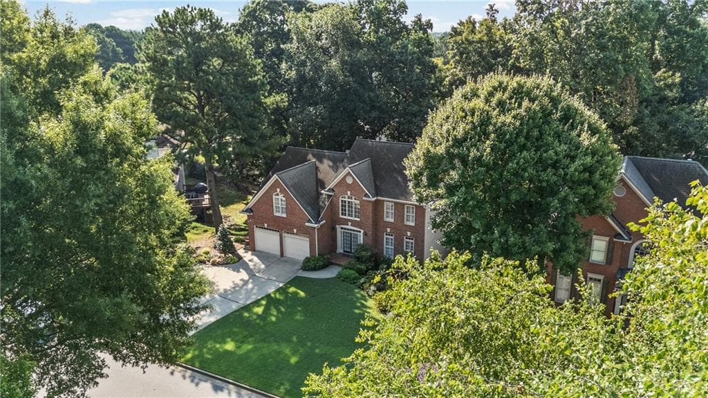 5 bedroom, 4 bathroom, 4,050 sq ft single family residence for sale at 5785 Millwick Drive, Johns Creek, GA 30005 — photo 3