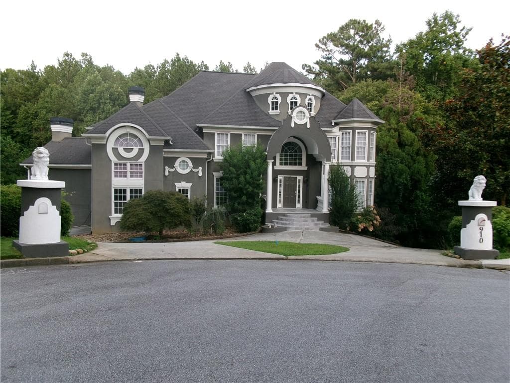 6 bedroom, 6 bathroom, 5,959 sq ft single family residence for sale at 910 Woodward Park Drive, Suwanee, GA 30024 — photo 2