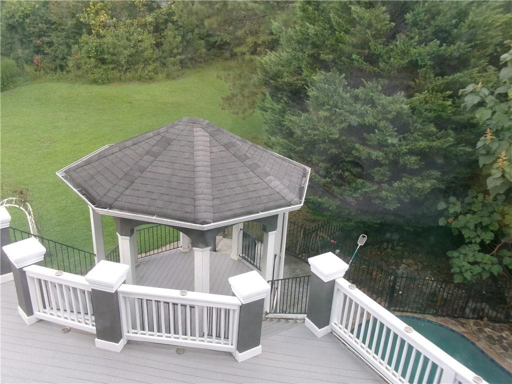 6 bedroom, 6 bathroom, 5,959 sq ft single family residence for sale at 910 Woodward Park Drive, Suwanee, GA 30024 — photo 7