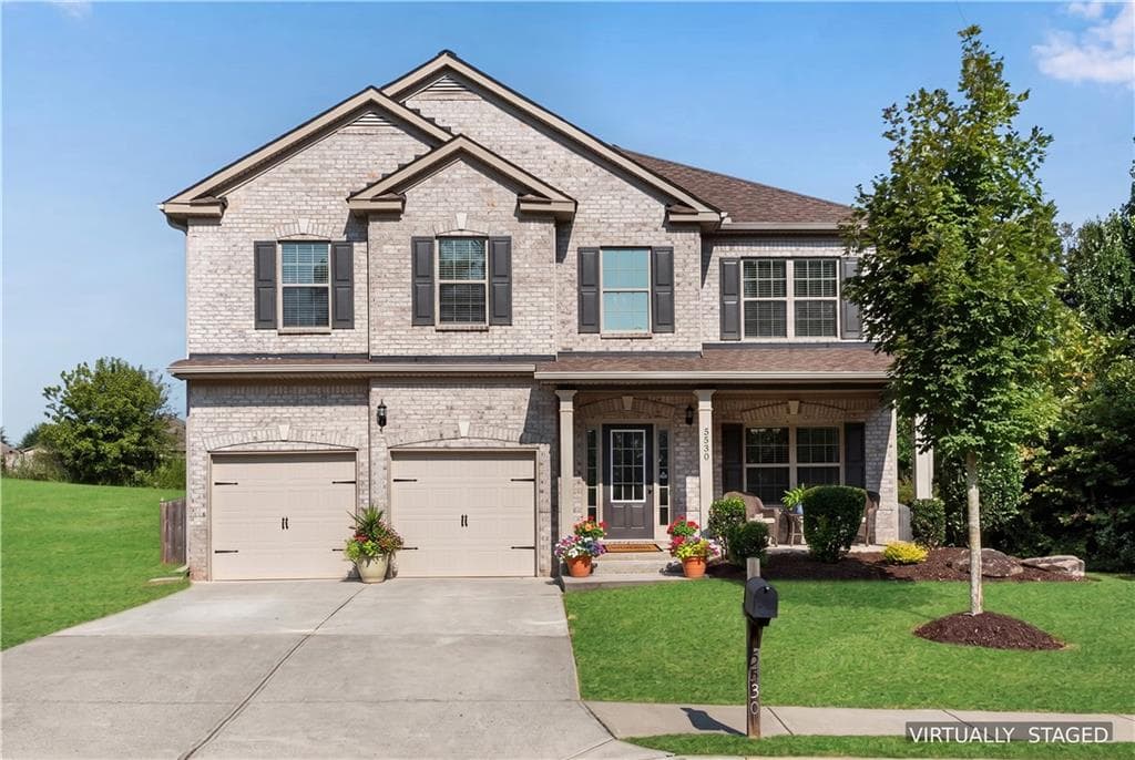 4 bedroom, 3 bathroom, 2,436 sq ft single family residence for sale at 5530 Banner Boulevard, Cumming, GA 30028 — photo 1 of 50
