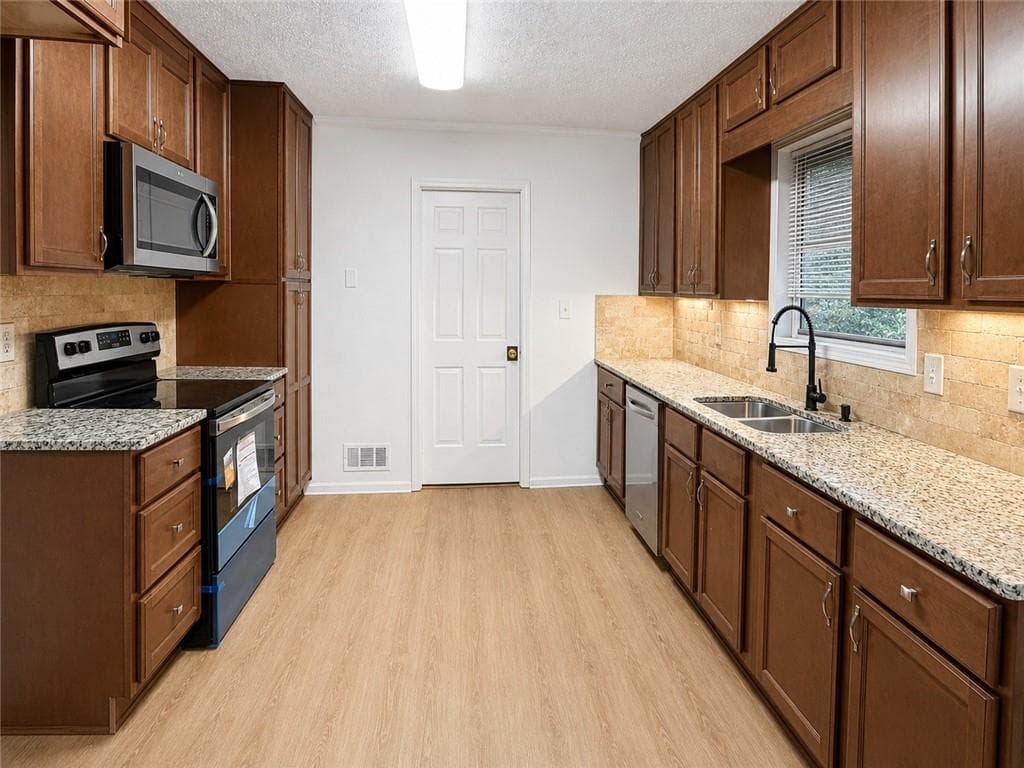 4 bedroom, 3 bathroom, 2,342 sq ft single family residence for sale at 177 Northwind Court, Lilburn, GA 30047 — photo 6