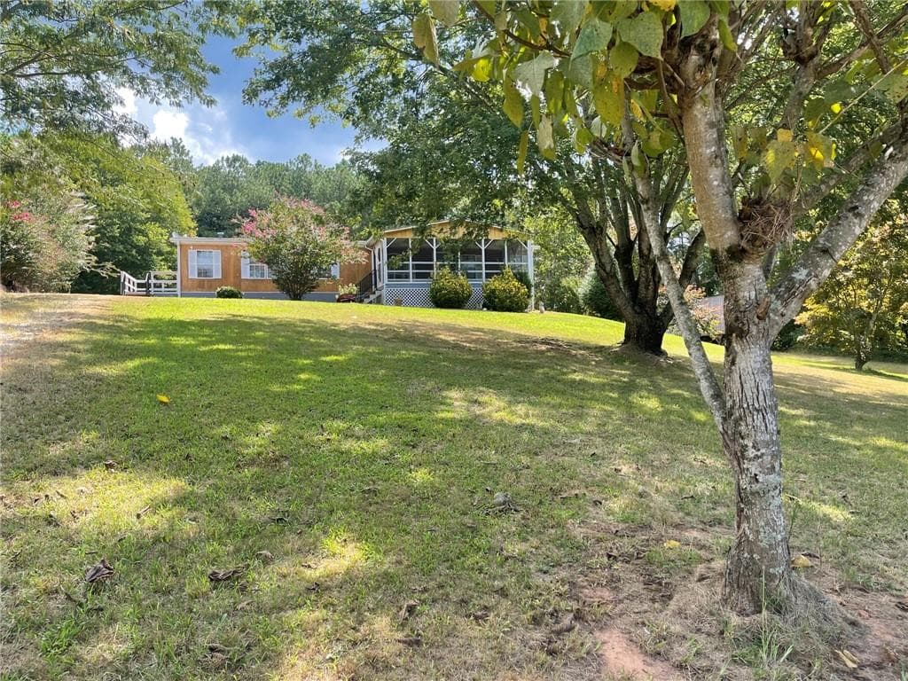 3 bedroom, 2 bathroom single family residence under contract at 74 Bridle Path Drive, Ball Ground, GA 30107 — photo 2