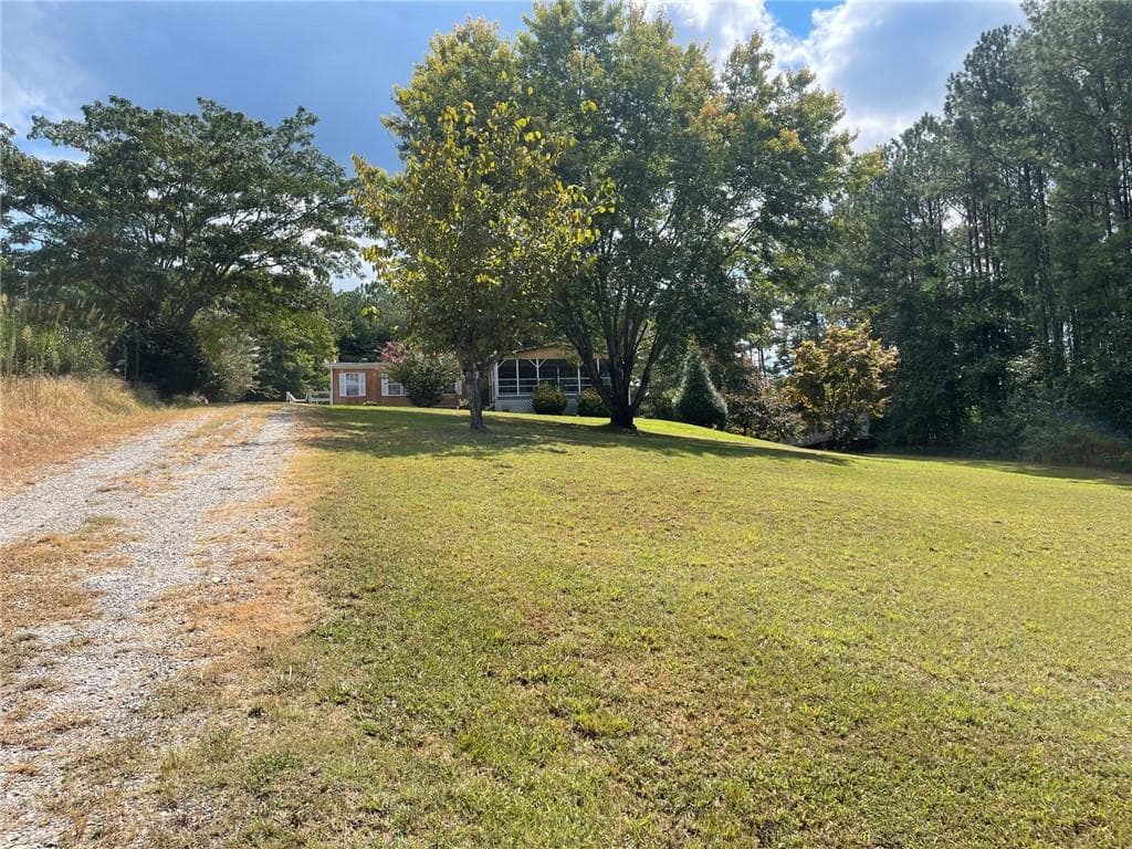 3 bedroom, 2 bathroom single family residence under contract at 74 Bridle Path Drive, Ball Ground, GA 30107 — photo 5