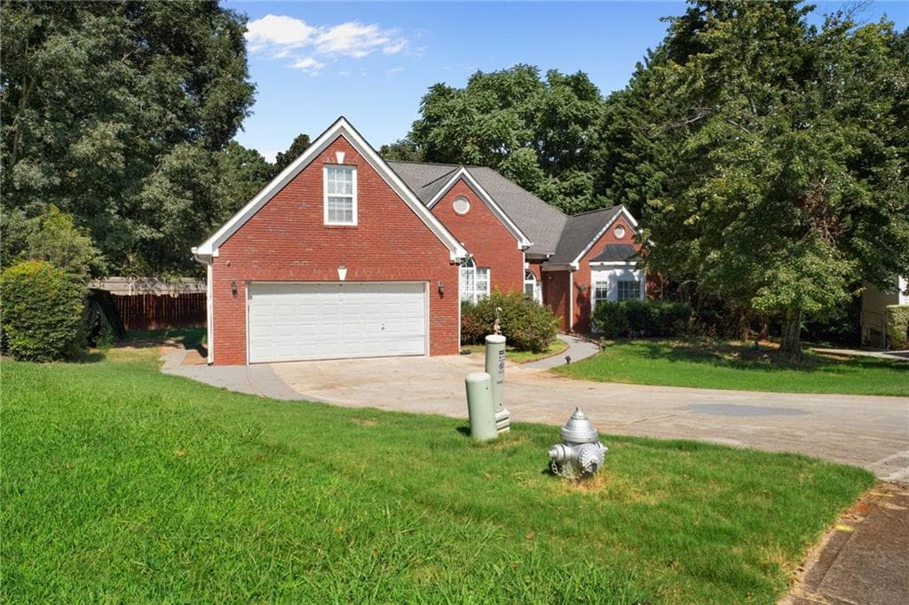 4 bedroom, 3 bathroom, 2,607 sq ft single family residence for sale at 1000 Georgian Hills Dr, Lawrenceville, GA 30045 — photo 2