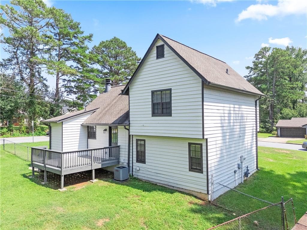 3 bedroom, 2 bathroom, 1,299 sq ft single family residence for sale at 9386 Woodknoll Lane, Jonesboro, GA 30238 — photo 4