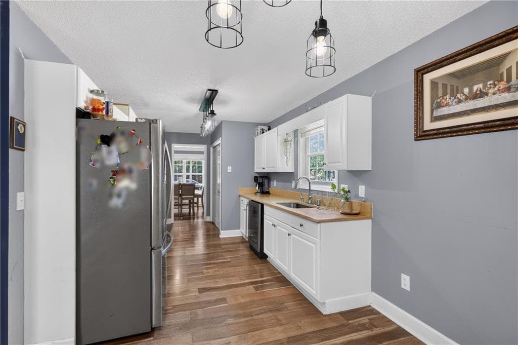 4 bedroom, 3 bathroom, 1,952 sq ft single family residence for sale at 4009 Saint George Walk, Powder Springs, GA 30127 — photo 4