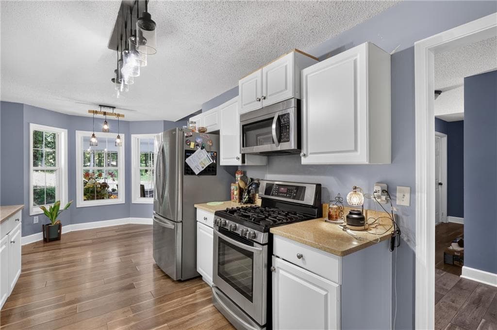 4 bedroom, 3 bathroom, 1,952 sq ft single family residence for sale at 4009 Saint George Walk, Powder Springs, GA 30127 — photo 8