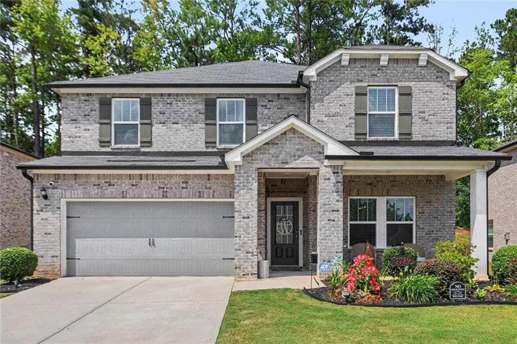5 bedroom, 3 bathroom, 2,674 sq ft single family residence for sale at 7789 Richmond Trail, Fairburn, GA 30213 — photo 1 of 32