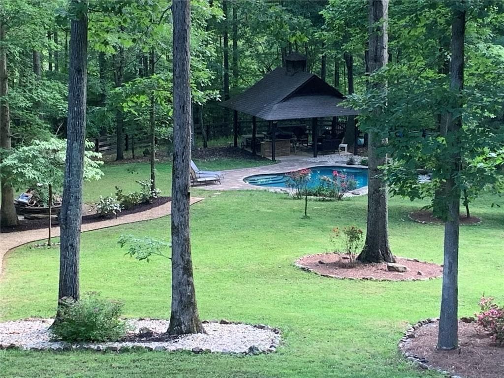 6 bedroom, 5 bathroom, 5,855 sq ft single family residence for sale at 8350 Jacobs Ridge Lane, Cumming, GA 30028 — photo 2