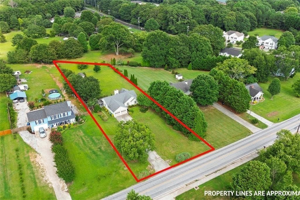 3 bedroom, 2 bathroom, 1,442 sq ft single family residence for sale at 3100 Oak Grove Road, Loganville, GA 30052 — photo 2